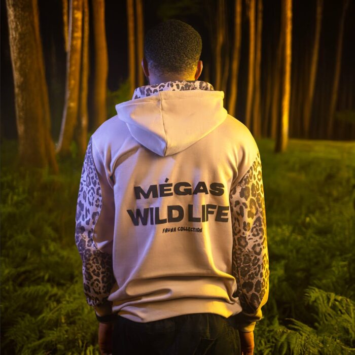 Man in the woods wearing Megas Jungz Hood